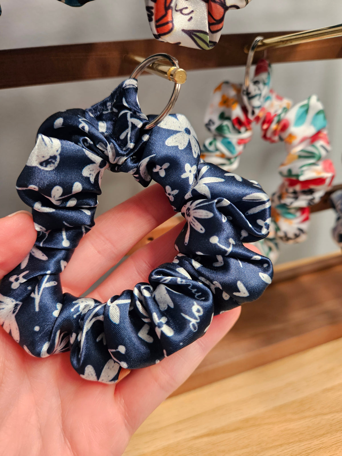 Scrunchie-style Catholic fabric wristlets with clasp claw as a keychain