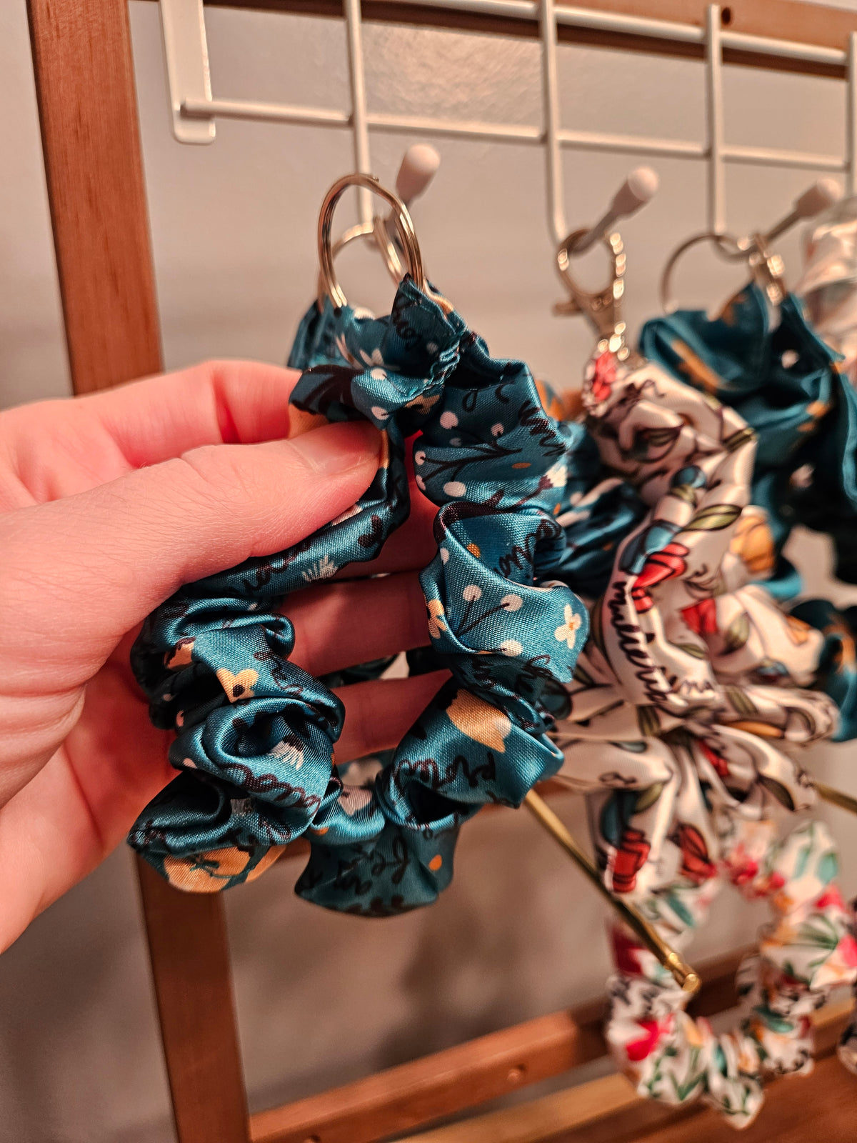Scrunchie-style Catholic fabric wristlets with clasp claw as a keychain
