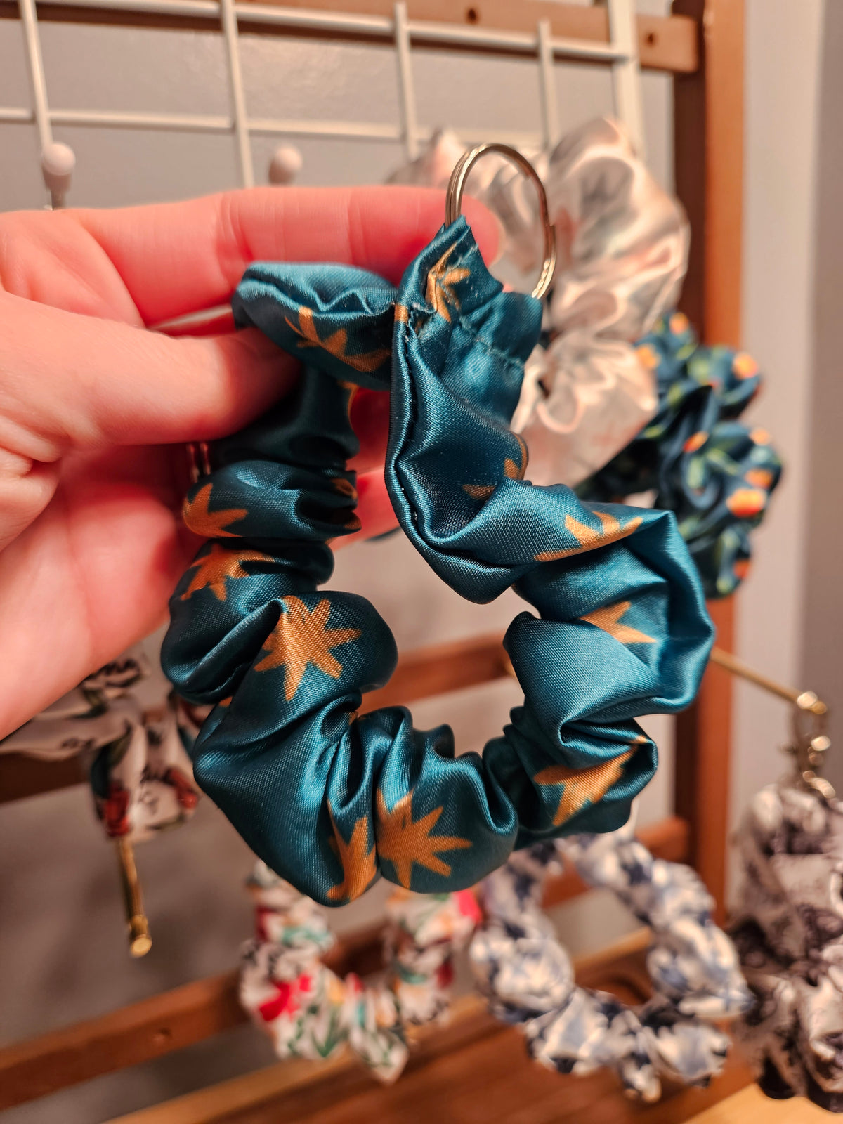 Scrunchie-style Catholic fabric wristlets with clasp claw as a keychain