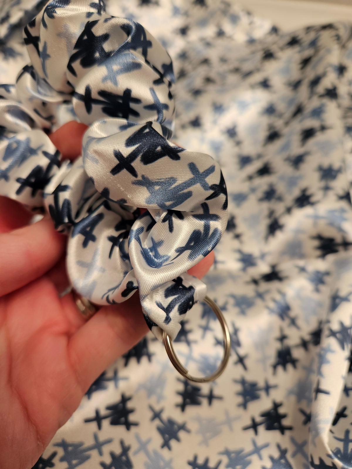 Scrunchie-style Catholic fabric wristlets with clasp claw as a keychain