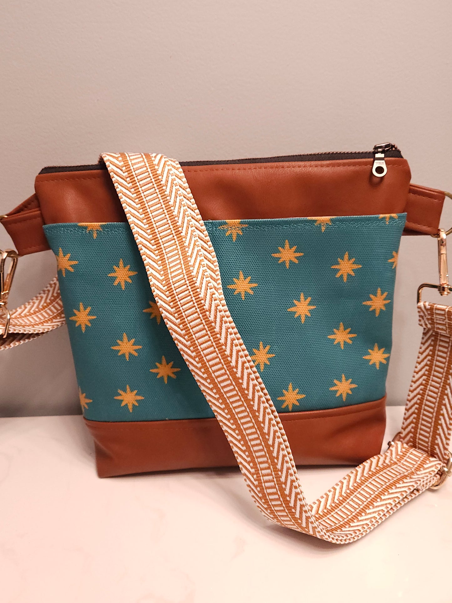 Catholic crossbody with exterior slip pockets in the Melissa Collection