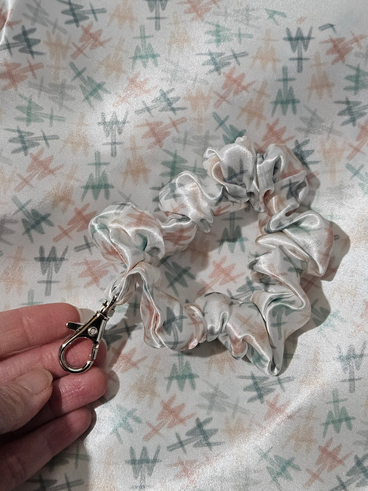 Scrunchie-style Catholic fabric wristlets with clasp claw as a keychain